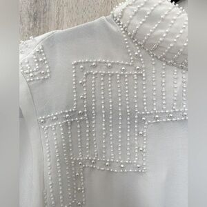 White beaded long sleeved blouse. New with tags from Anthropologie. Size US8.